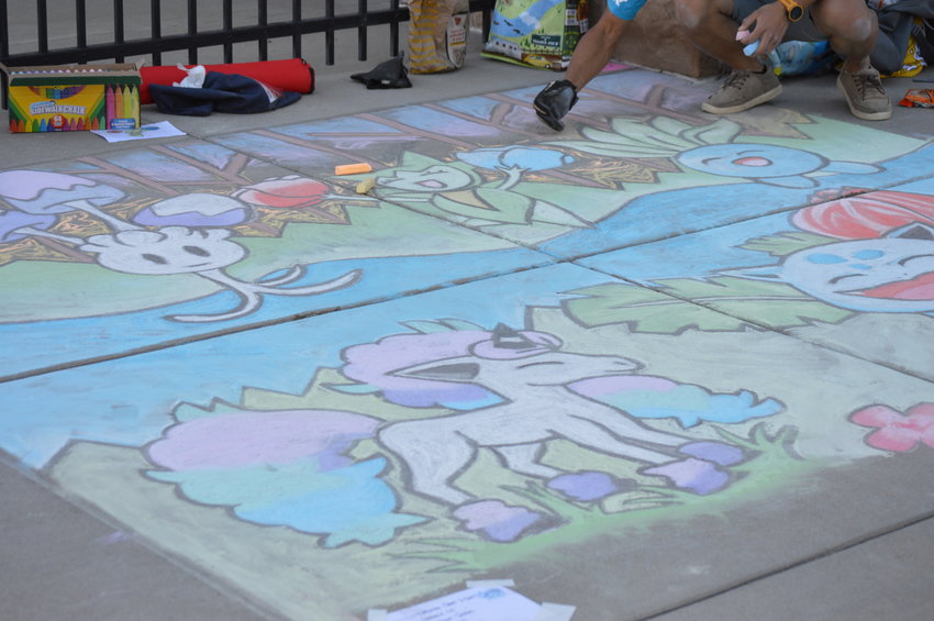 Josh Chow working on the "Pokémon Jubilee" art piece on Sept. 24 at The Streets at SouthGlenn.